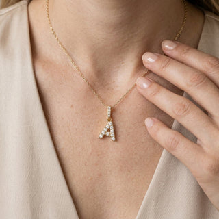 Initial pendant necklace — On Model - Jewelry Hands Detail | Generated by Modelize